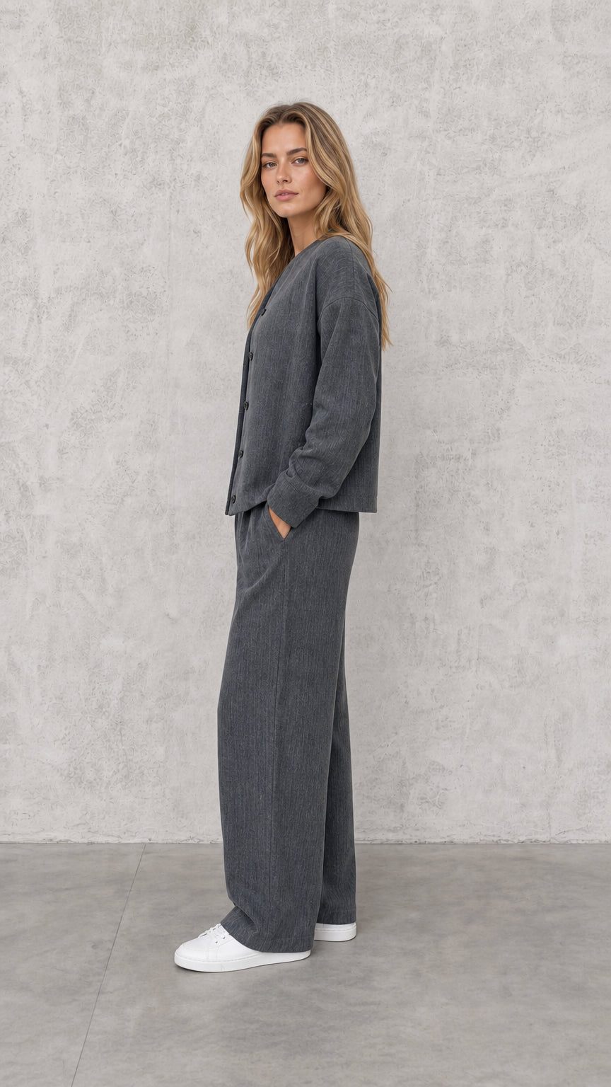 Side-angle view of model in Charcoal Grey matching two-piece lounge suit