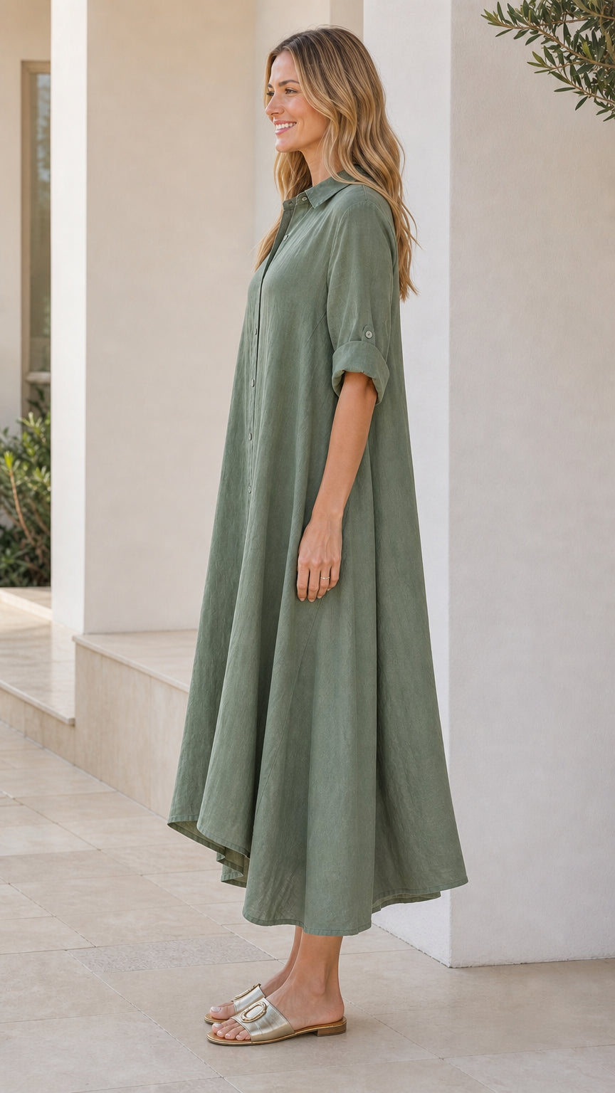 Side view of woman in sage green shirt dress with flat sandals