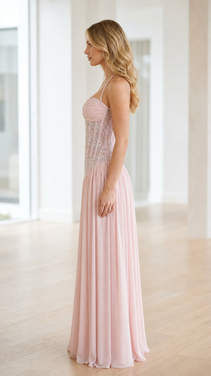 Side profile view of pink evening gown