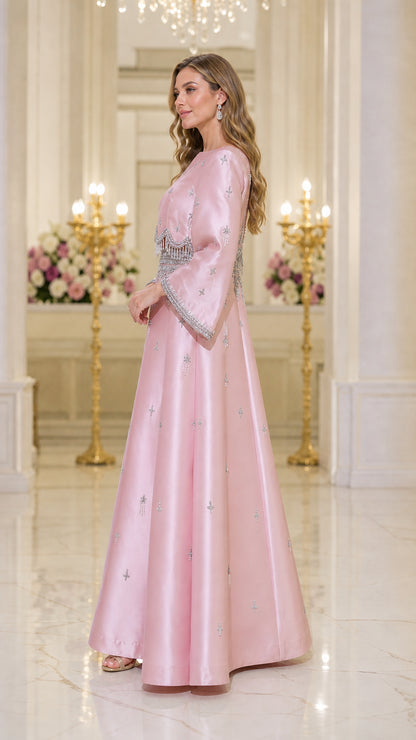 Side profile of model in pink evening gown