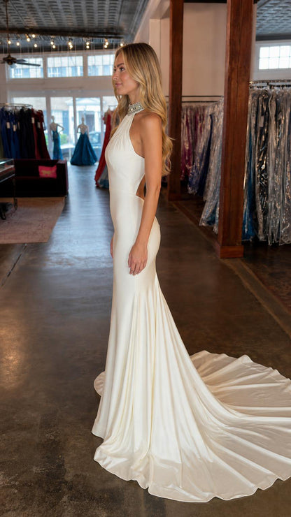 Side profile view of white formal evening dress