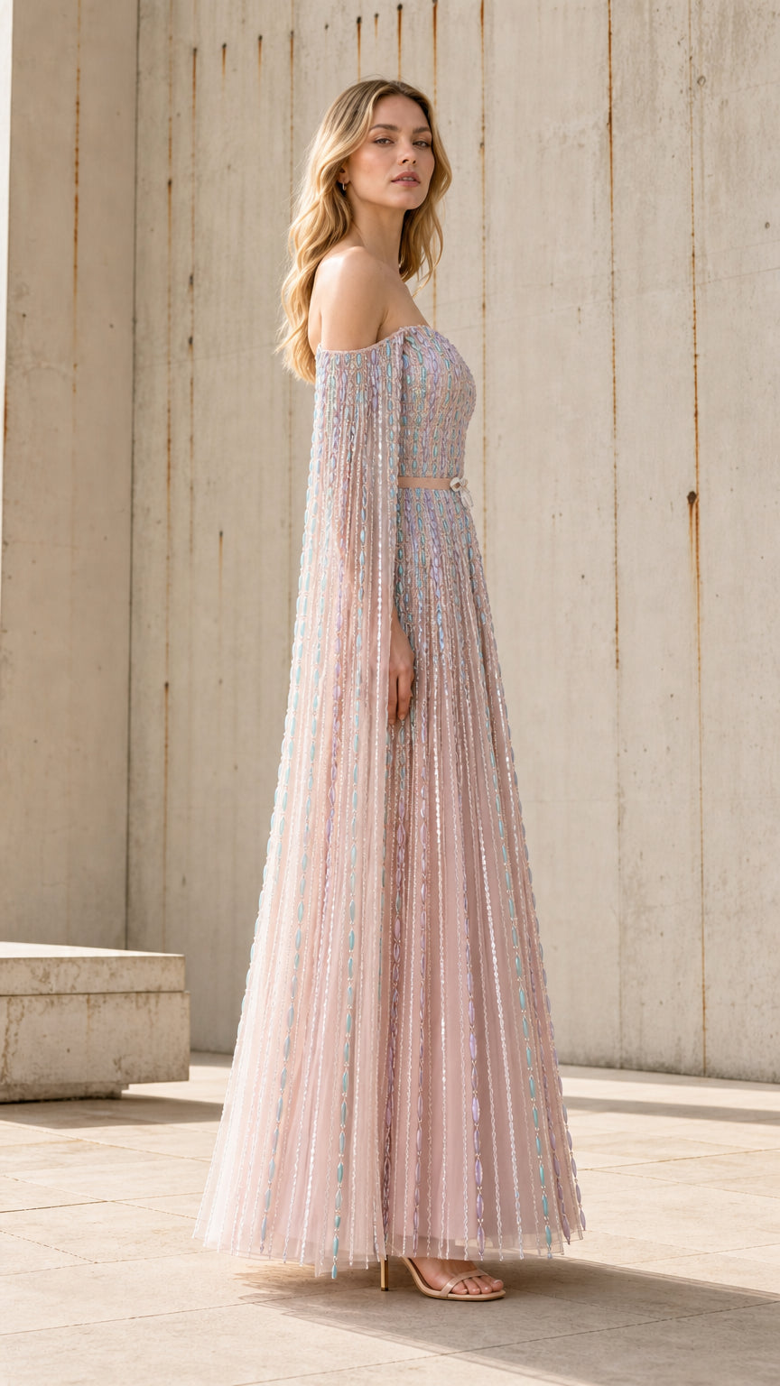 Side profile view of the pink embellished tulle gown