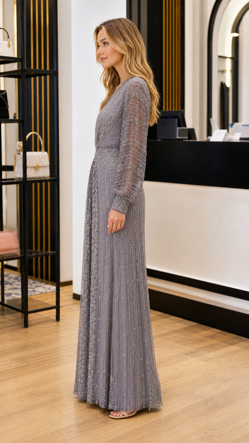 Side profile view of slate grey long sleeve formal maxi dress with gathered waist