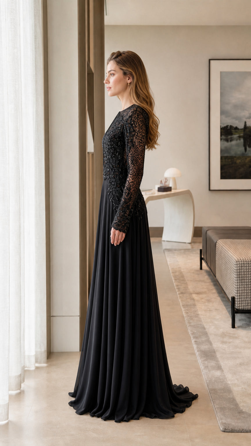 Side profile view of model in the black evening gown