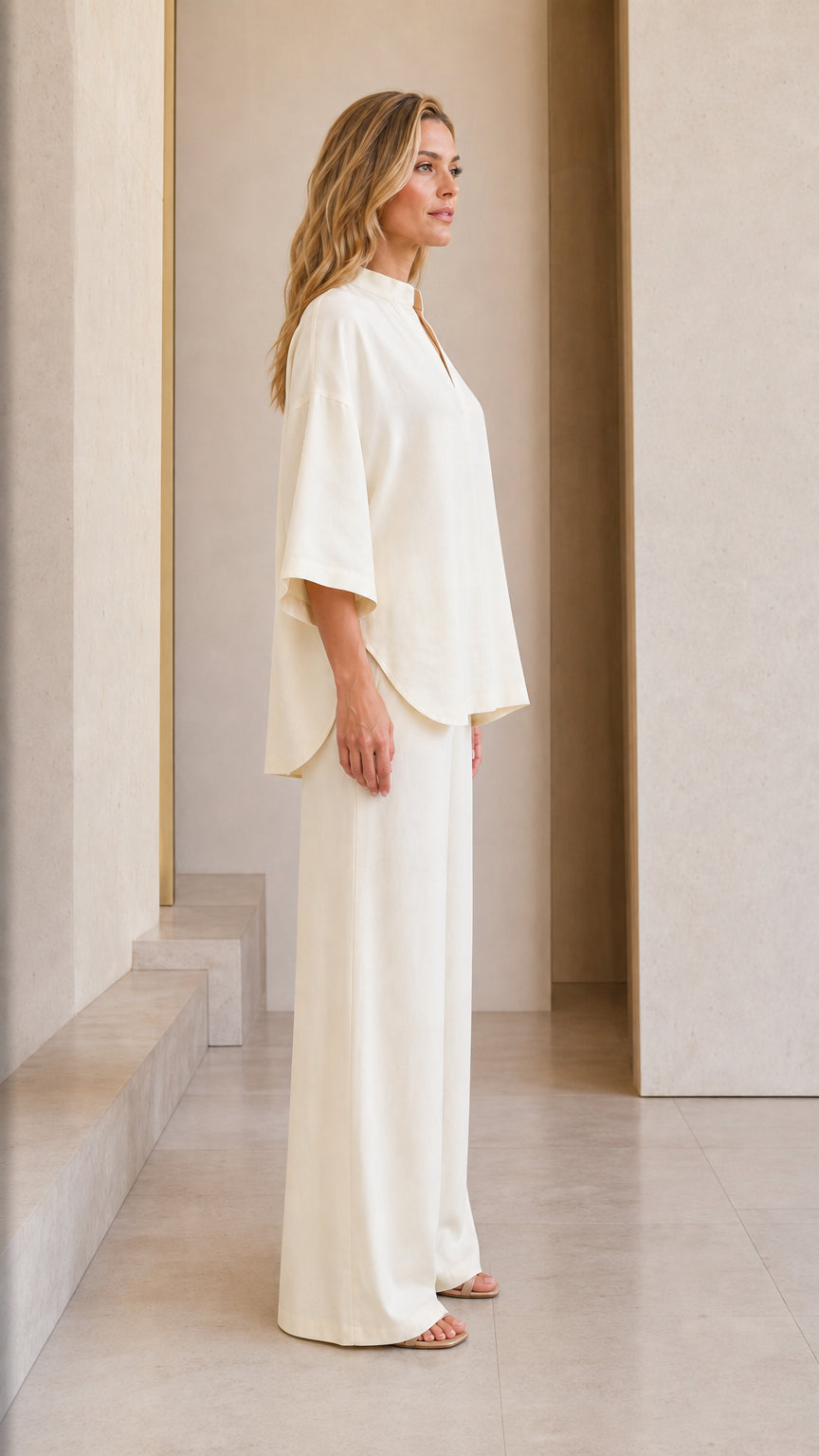 Side profile view of cream lounge set on model