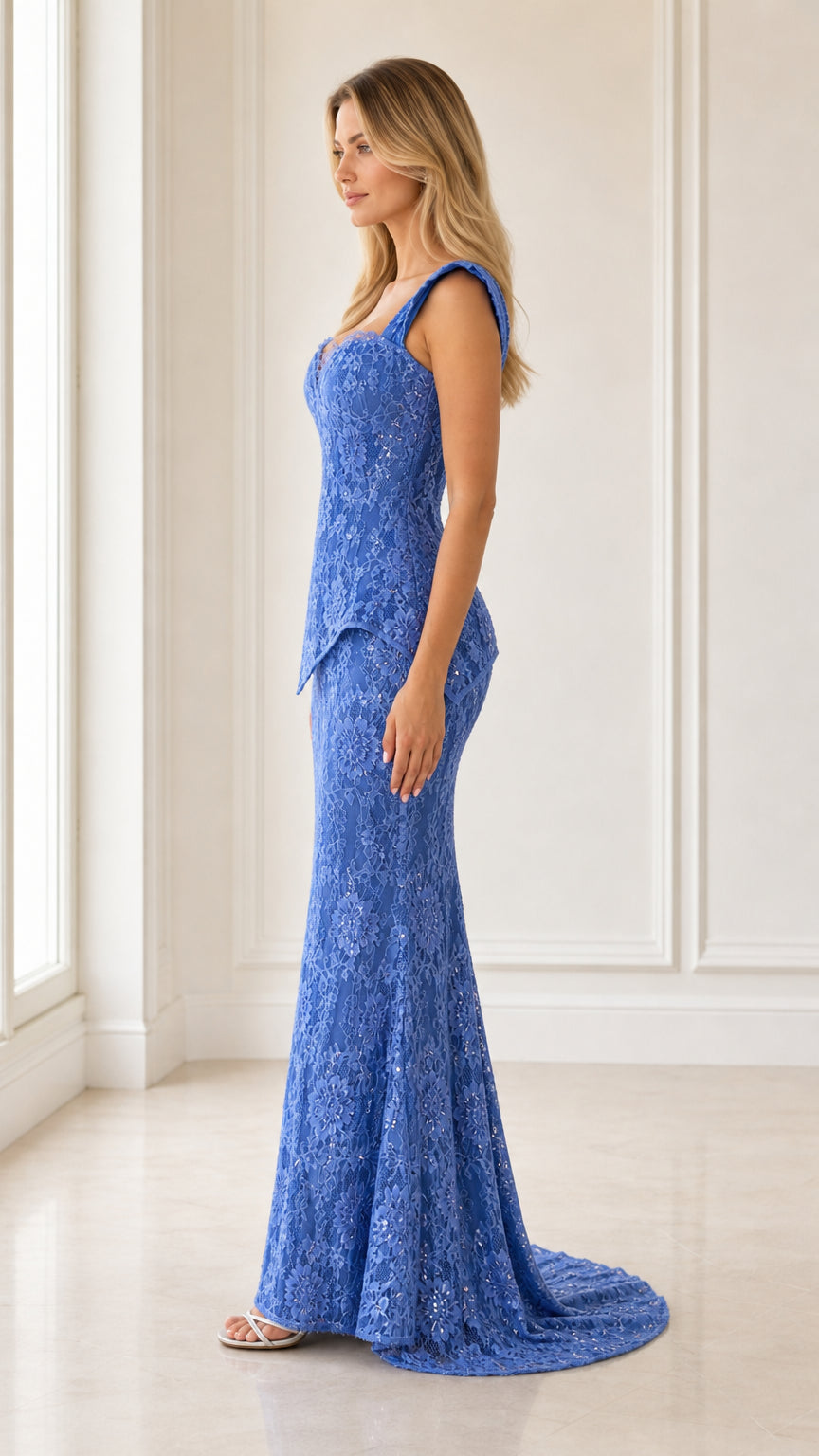 Side profile of blue lace peplum evening gown