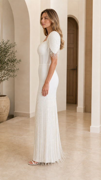 Side profile of elegant white beaded fringe maxi dress