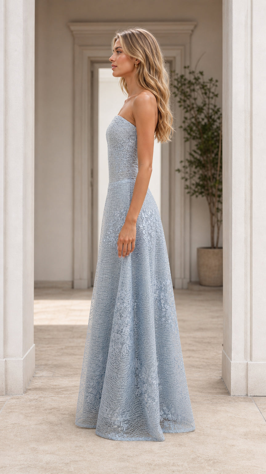 Side profile view of light blue strapless evening gown