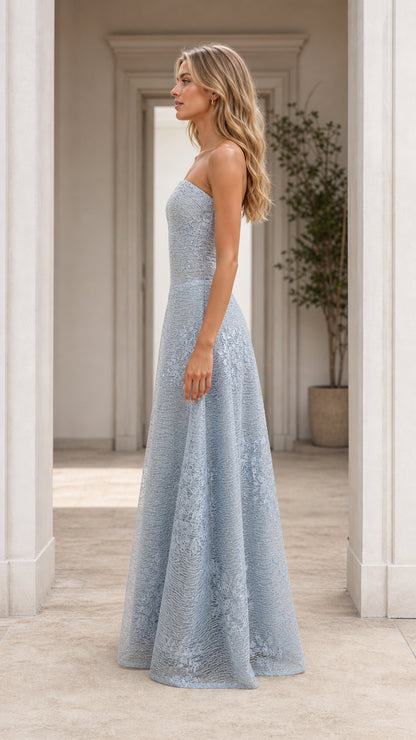 Side profile view of light blue strapless evening gown