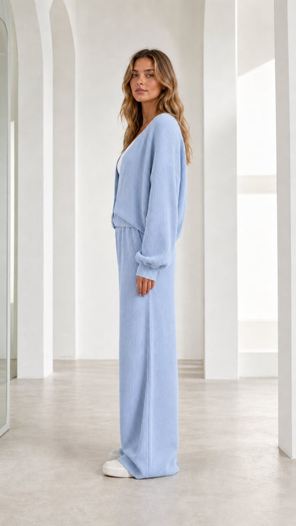 Side profile of woman in light blue lounge set