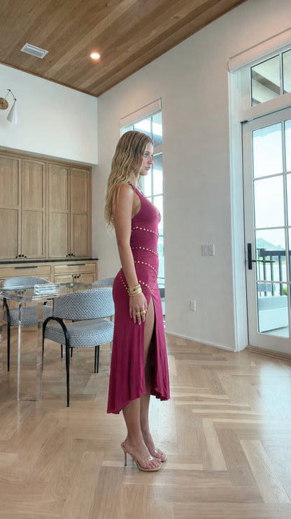 Woman wearing burgundy embellished halter midi dress side view