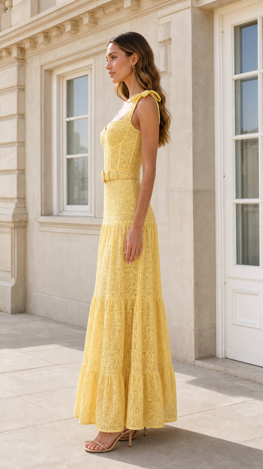 Side view of yellow lace maxi dress with bow straps