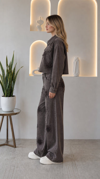 Side profile view of woman wearing washed grey rhinestone embellished denim co-ord set