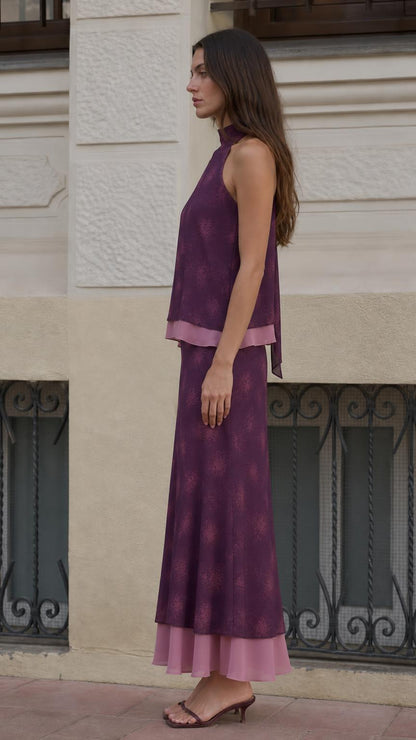 Side view of model wearing purple layered two-piece set