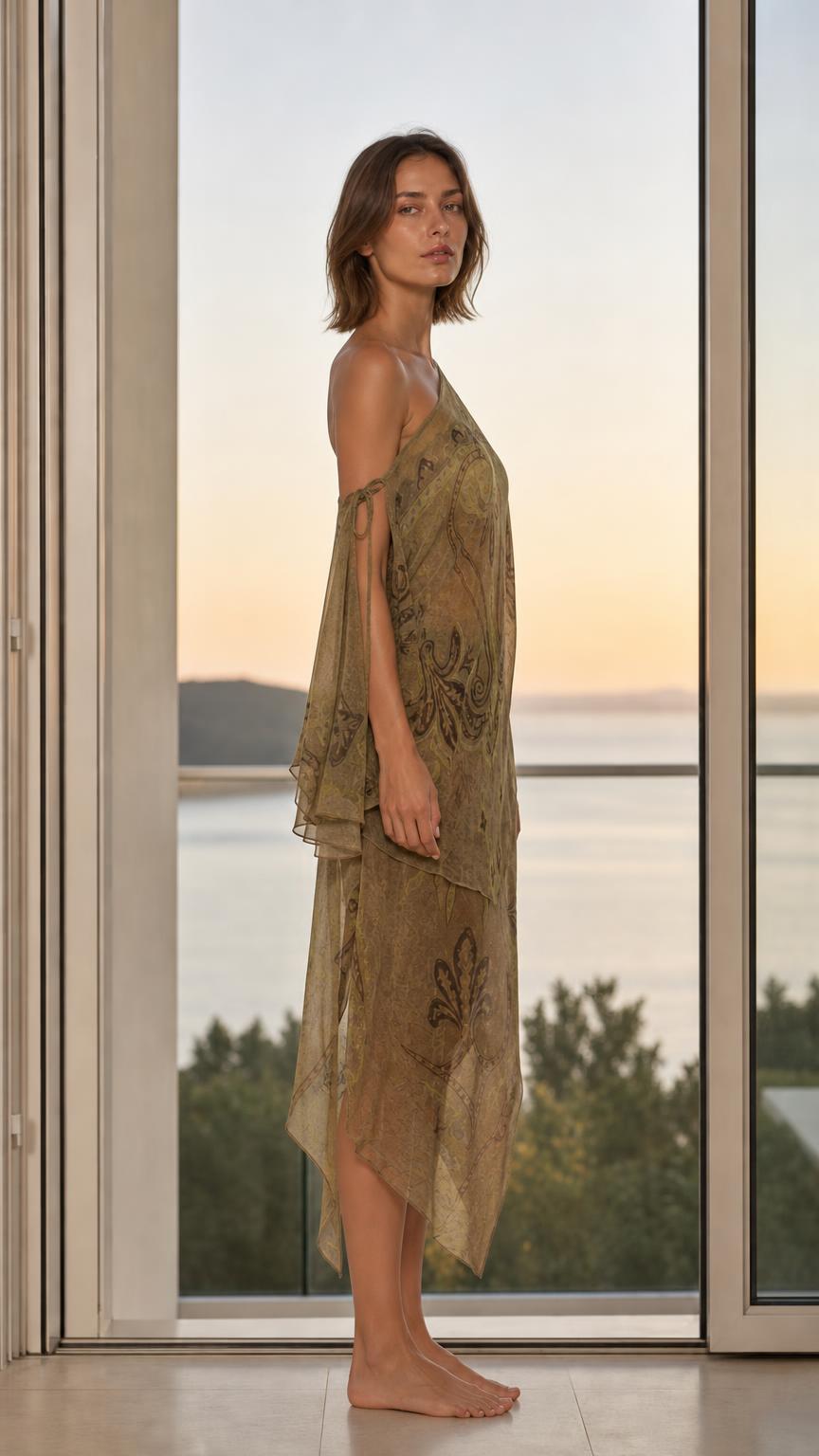 Model wearing olive paisley dress side profile view
