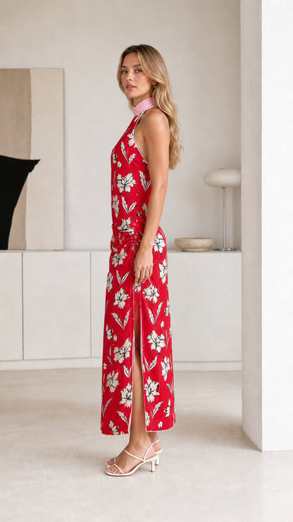 Side view of red floral maxi dress showing side slit