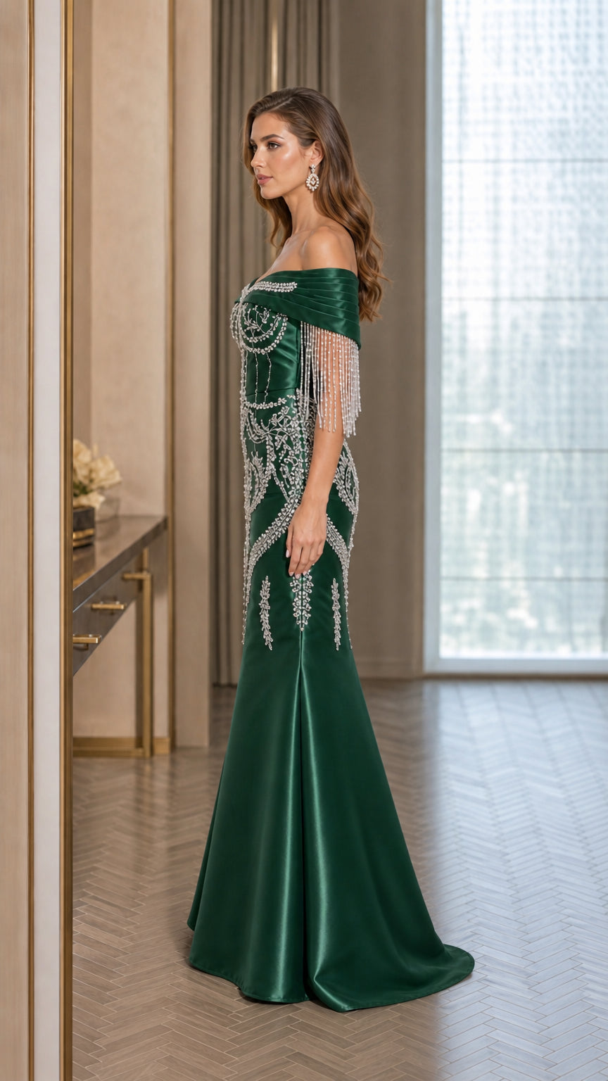 Side profile of emerald green embellished satin evening dress