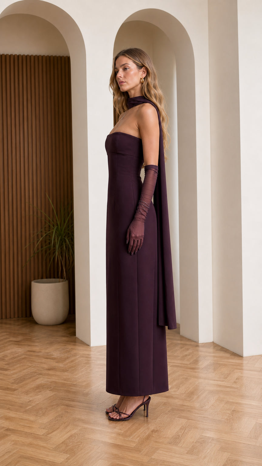 Side profile view of burgundy evening dress