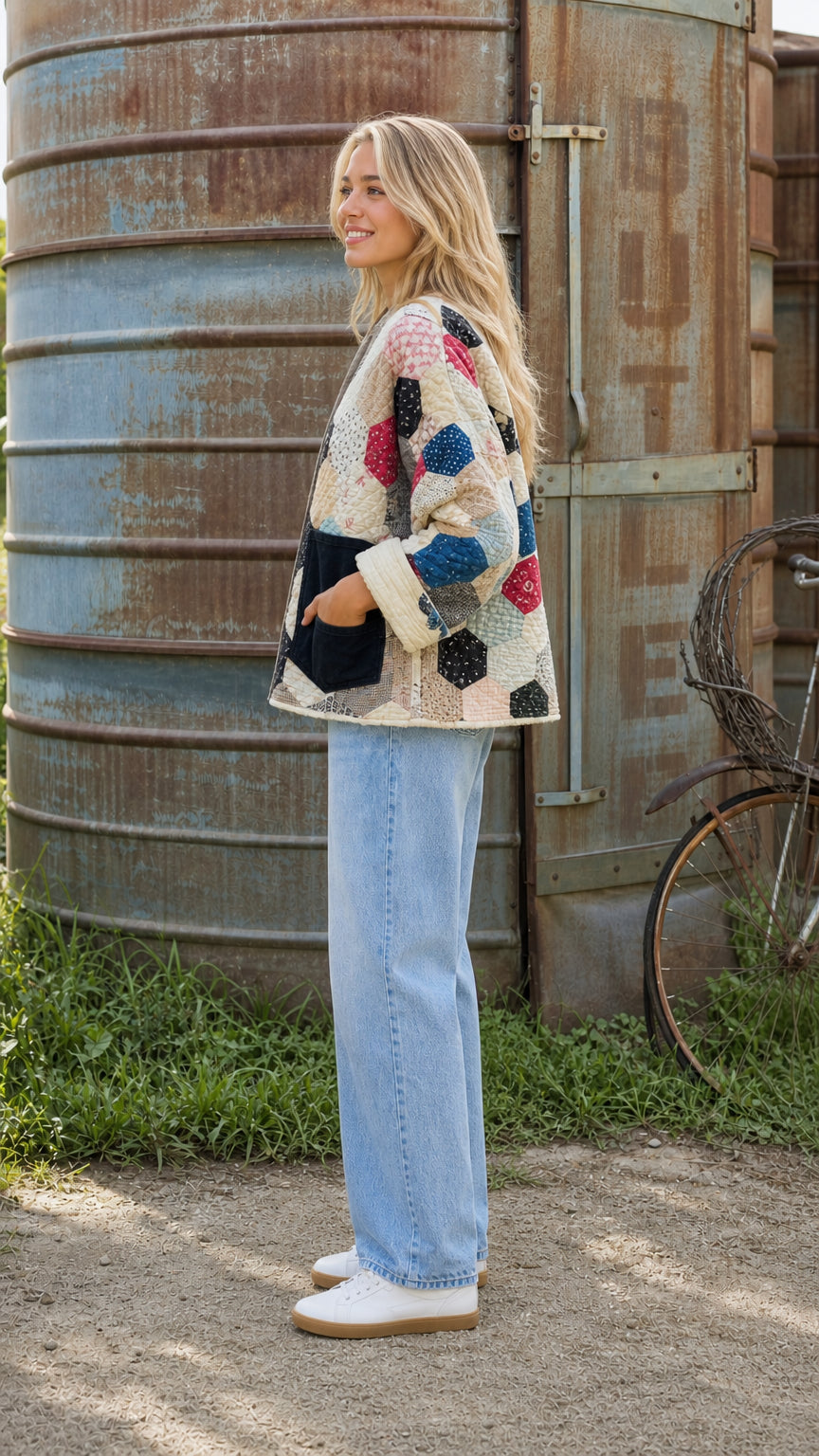 Side profile of model wearing cream patchwork jacket