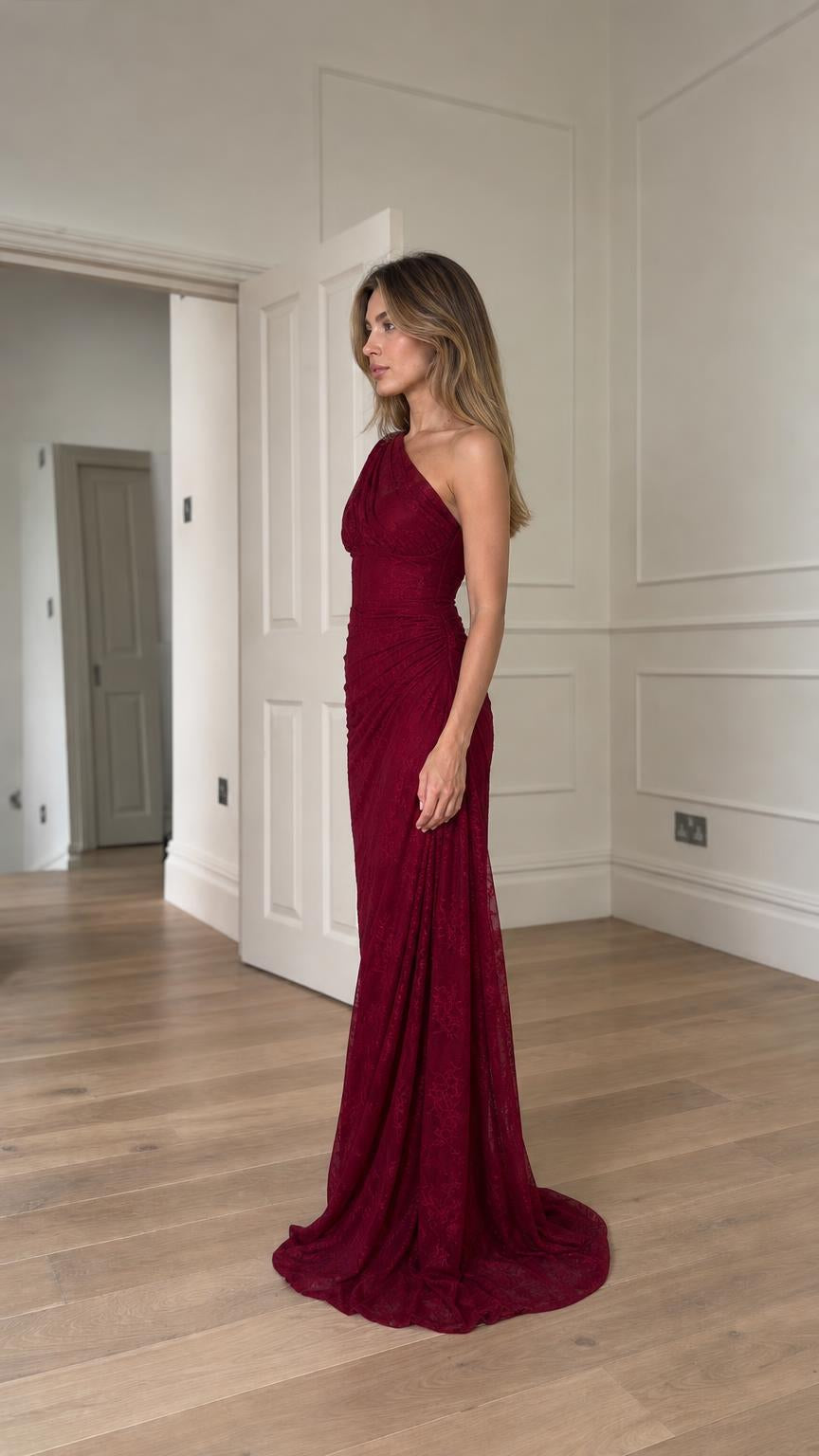 Side profile view of burgundy evening gown