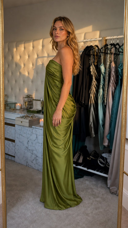 Model wearing olive satin strapless evening dress side view