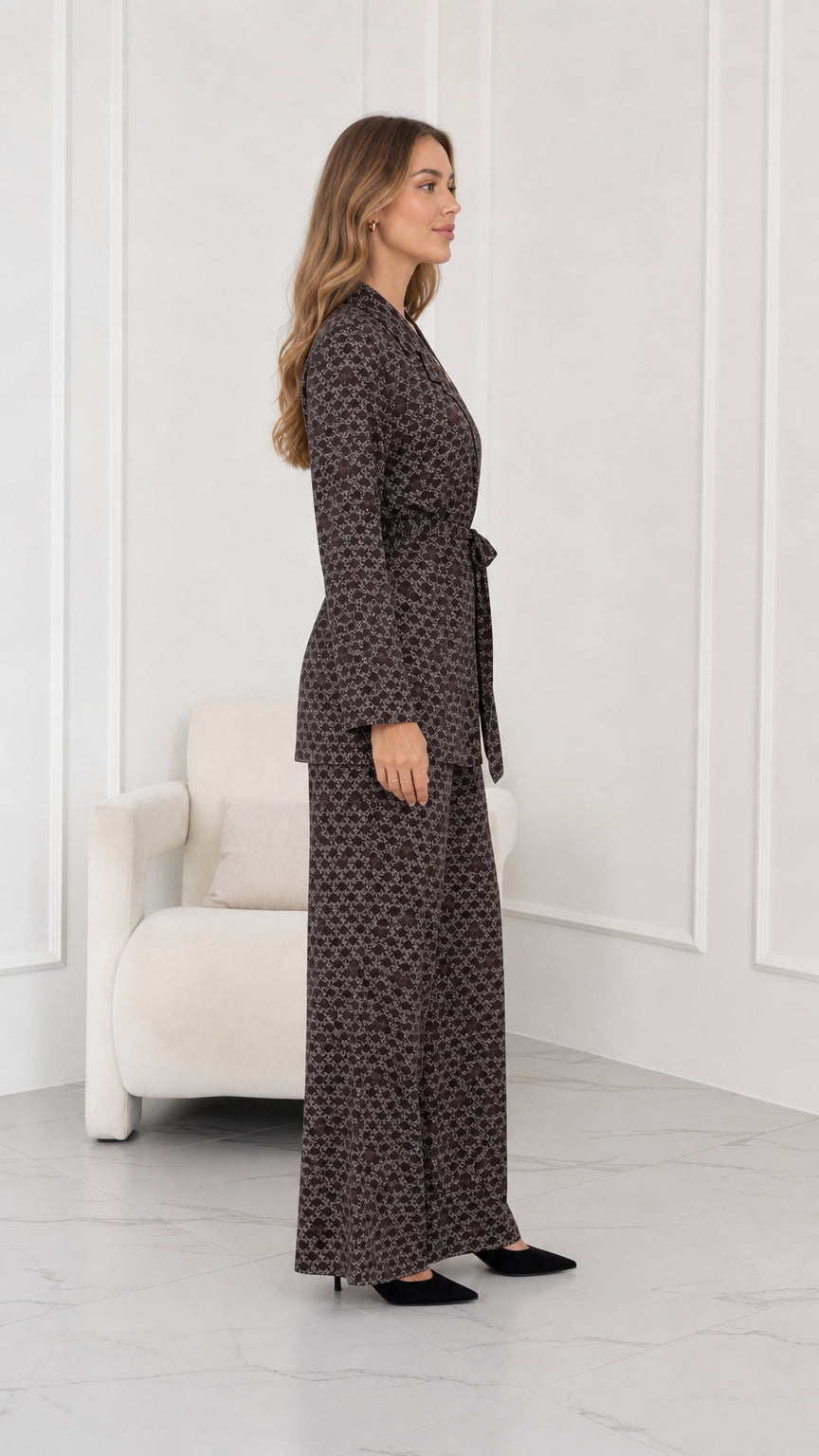 Side profile view of brown geometric print two piece pantsuit