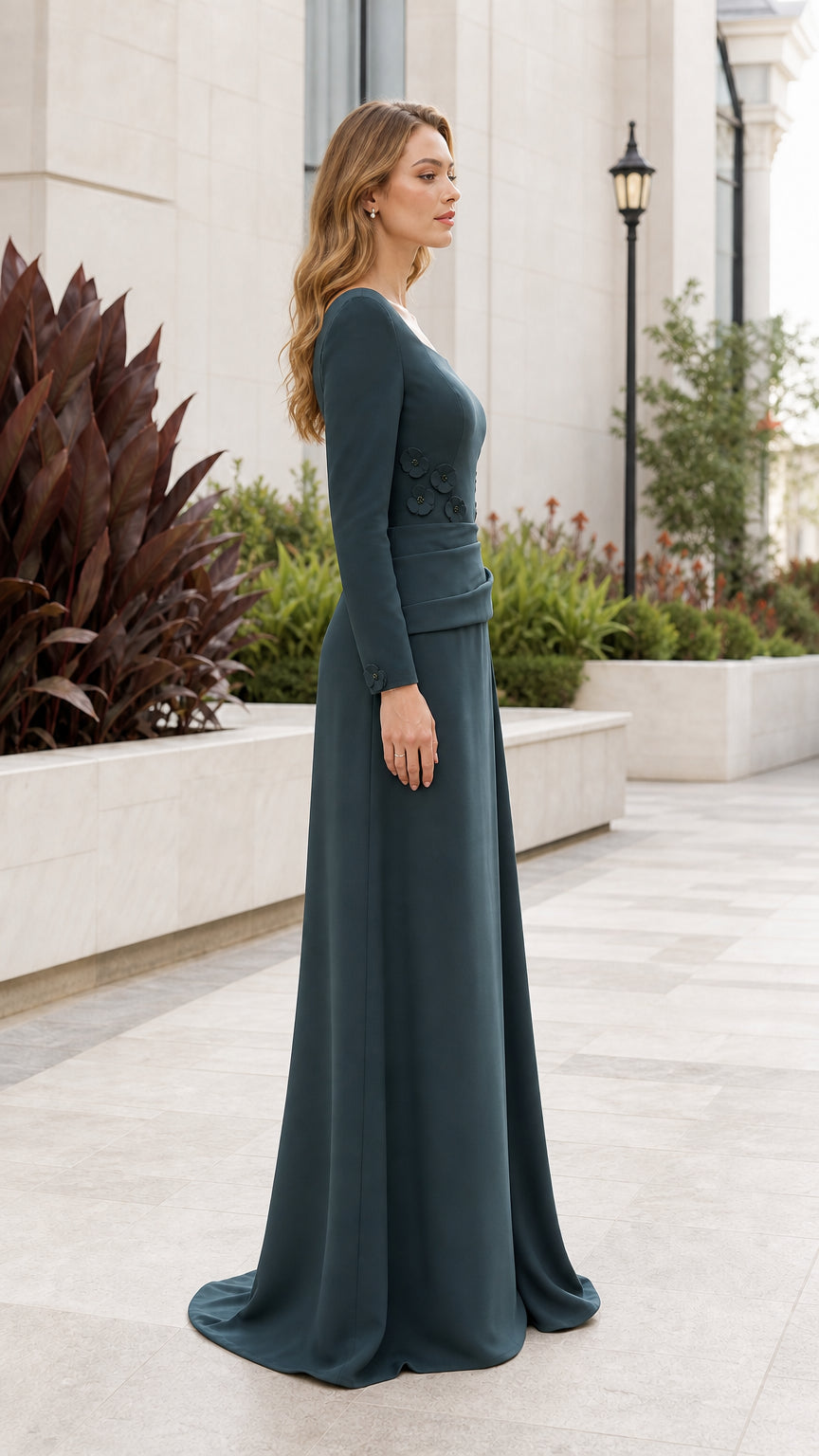 Side profile of dark teal formal gown with draped silhouette