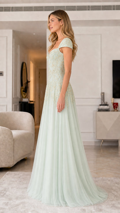 Side profile of sage green evening gown