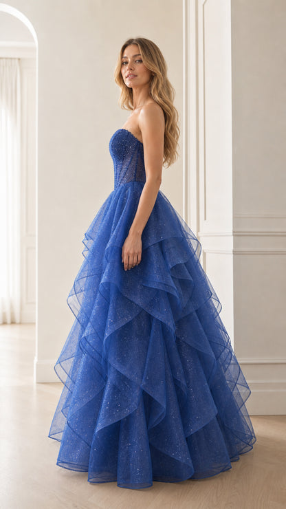 Side angle of royal blue tiered ruffle evening gown