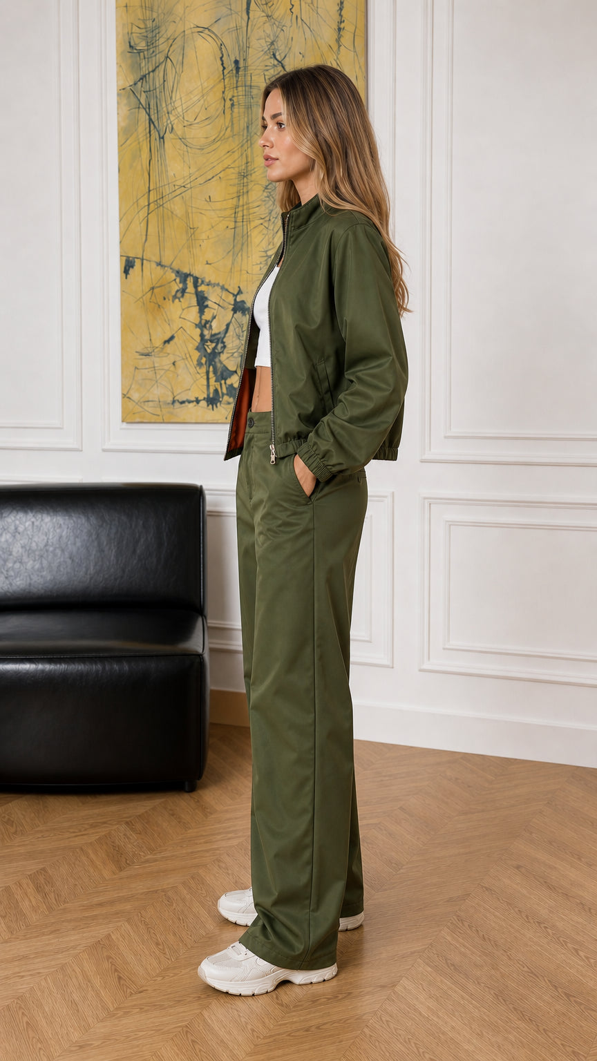 Side profile view of woman modeling the olive green two-piece jacket and pants set