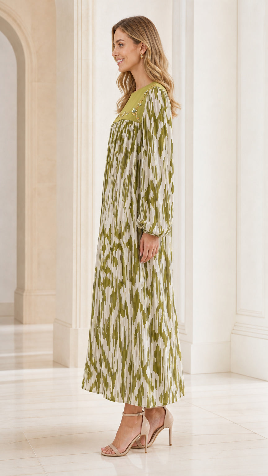Side profile of woman wearing olive green long sleeve pleated maxi dress