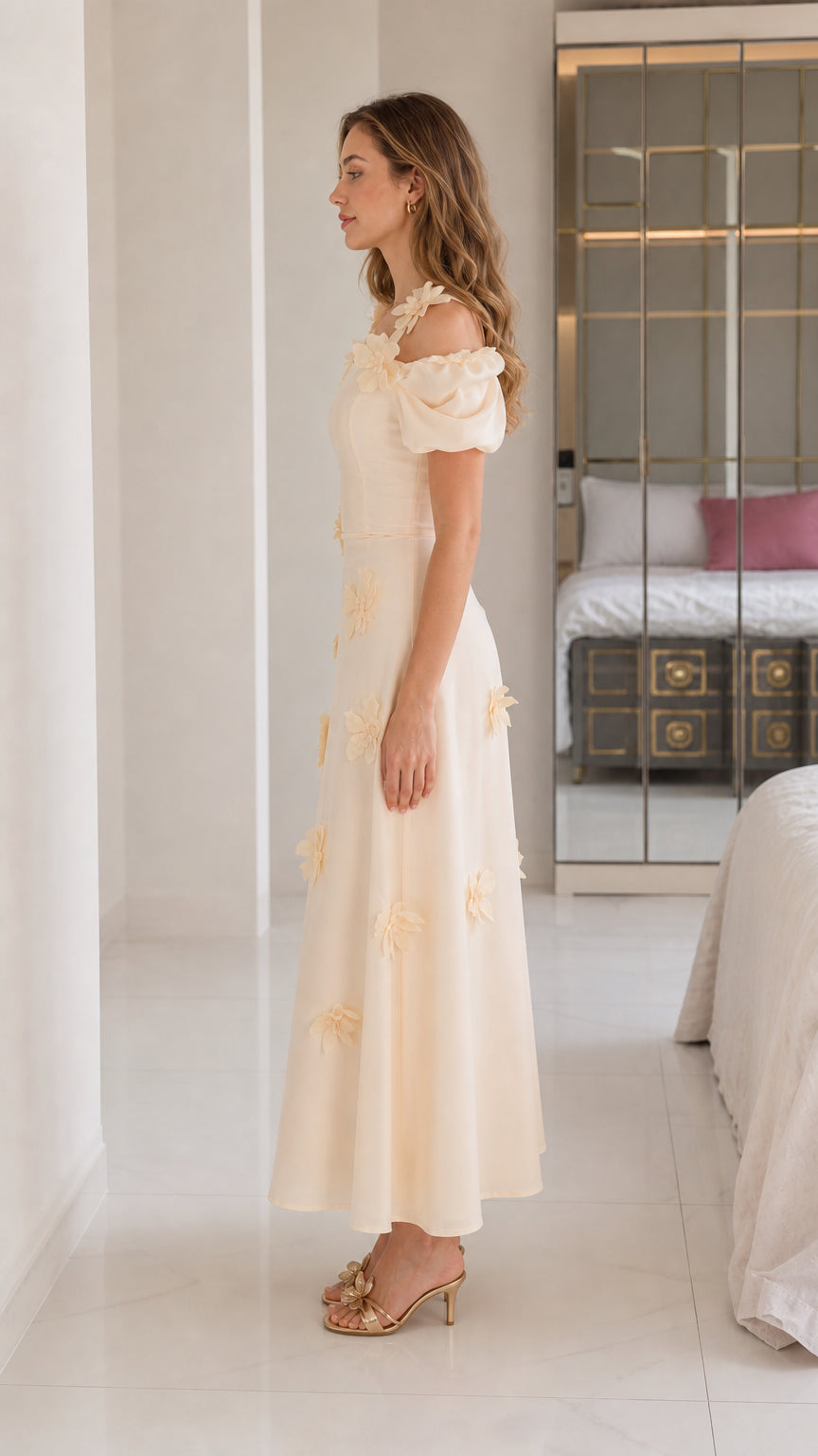 Side profile of cream floral applique midi dress