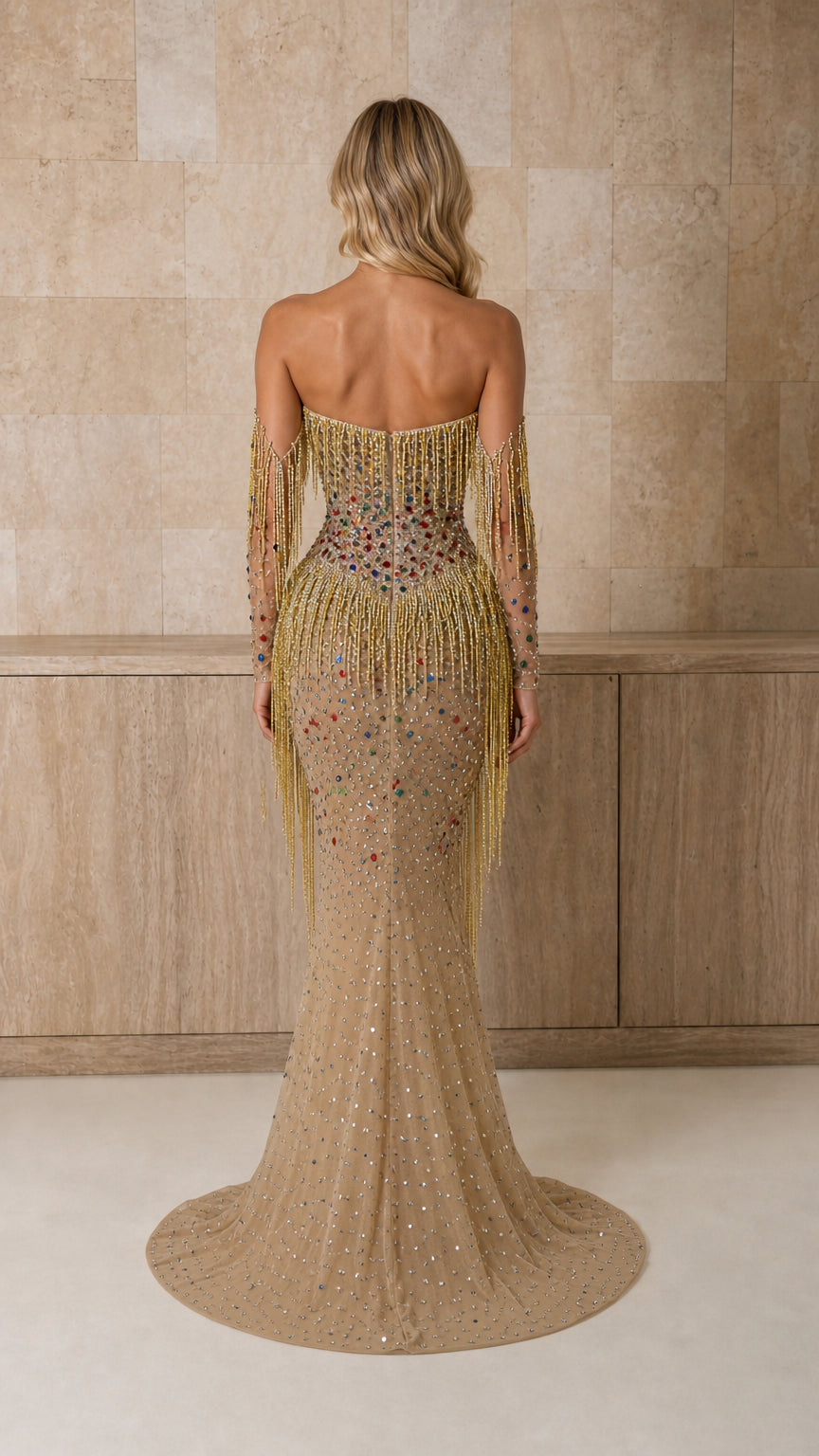 Back view of model in gold crystal-embellished gown