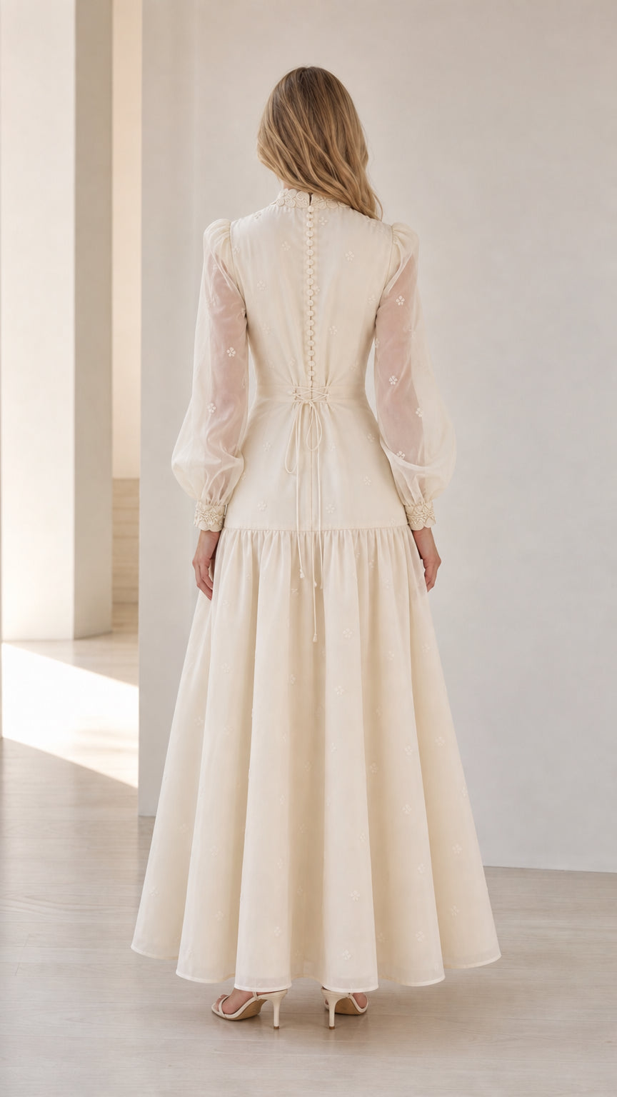 Back view of woman wearing Ivory formal evening gown with back tie