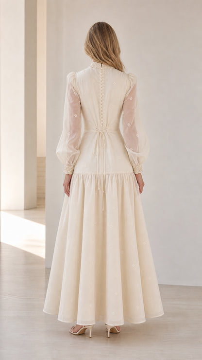 Back view of woman wearing Ivory formal evening gown with back tie