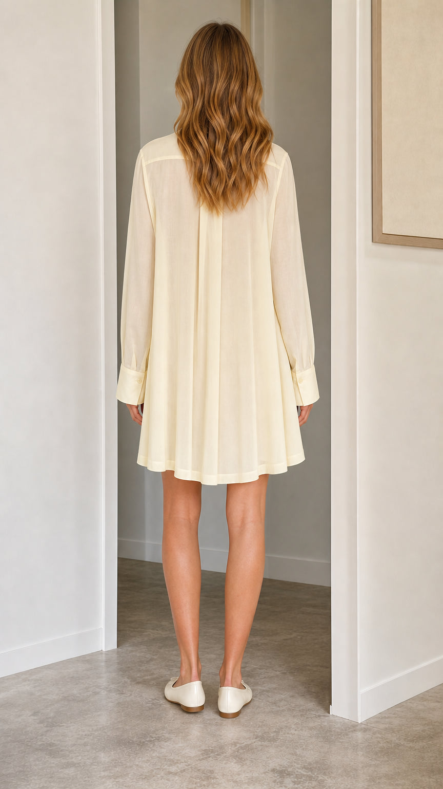 Back view of cream shift dress showing relaxed drape