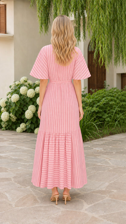 Back view of model wearing pink striped maxi dress with flutter sleeves