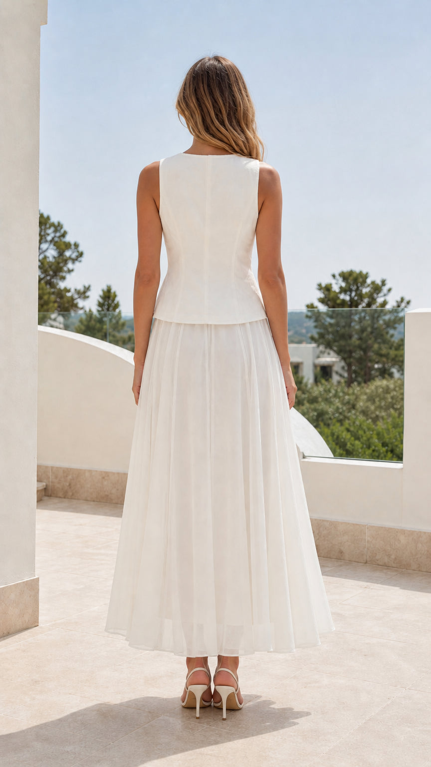 Back view of woman wearing white sleeveless skirt set