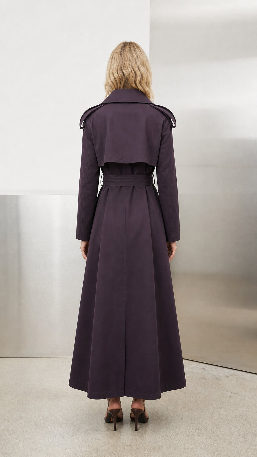 Back view of deep purple maxi trench coat showing back storm flap and vent