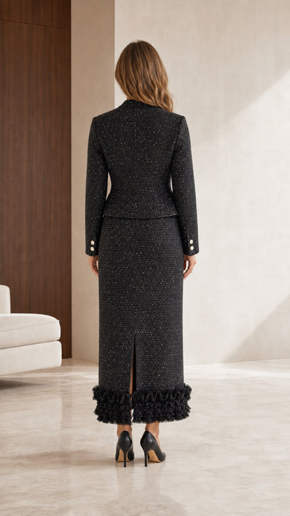 Back view of black tweed set with ruffle hem