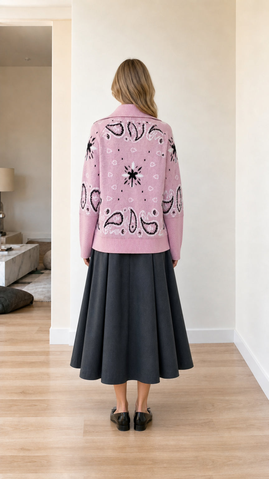 Back view of pink paisley jacquard knit jacket showing detailed back pattern