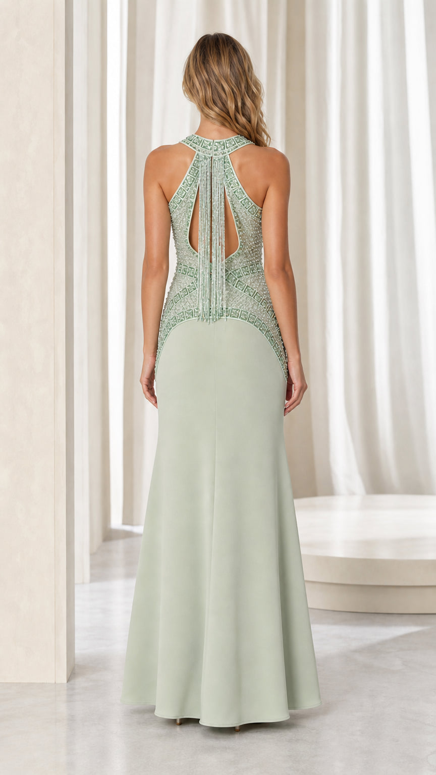 Back view showing keyhole cutout on sage green gown