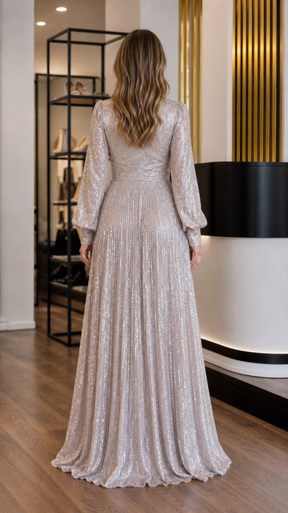 Silver sequin evening gown back view with pleated skirt