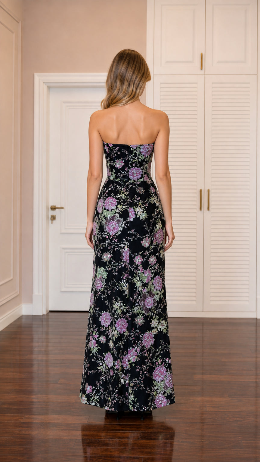 Back view of model wearing black strapless sequined floral evening gown