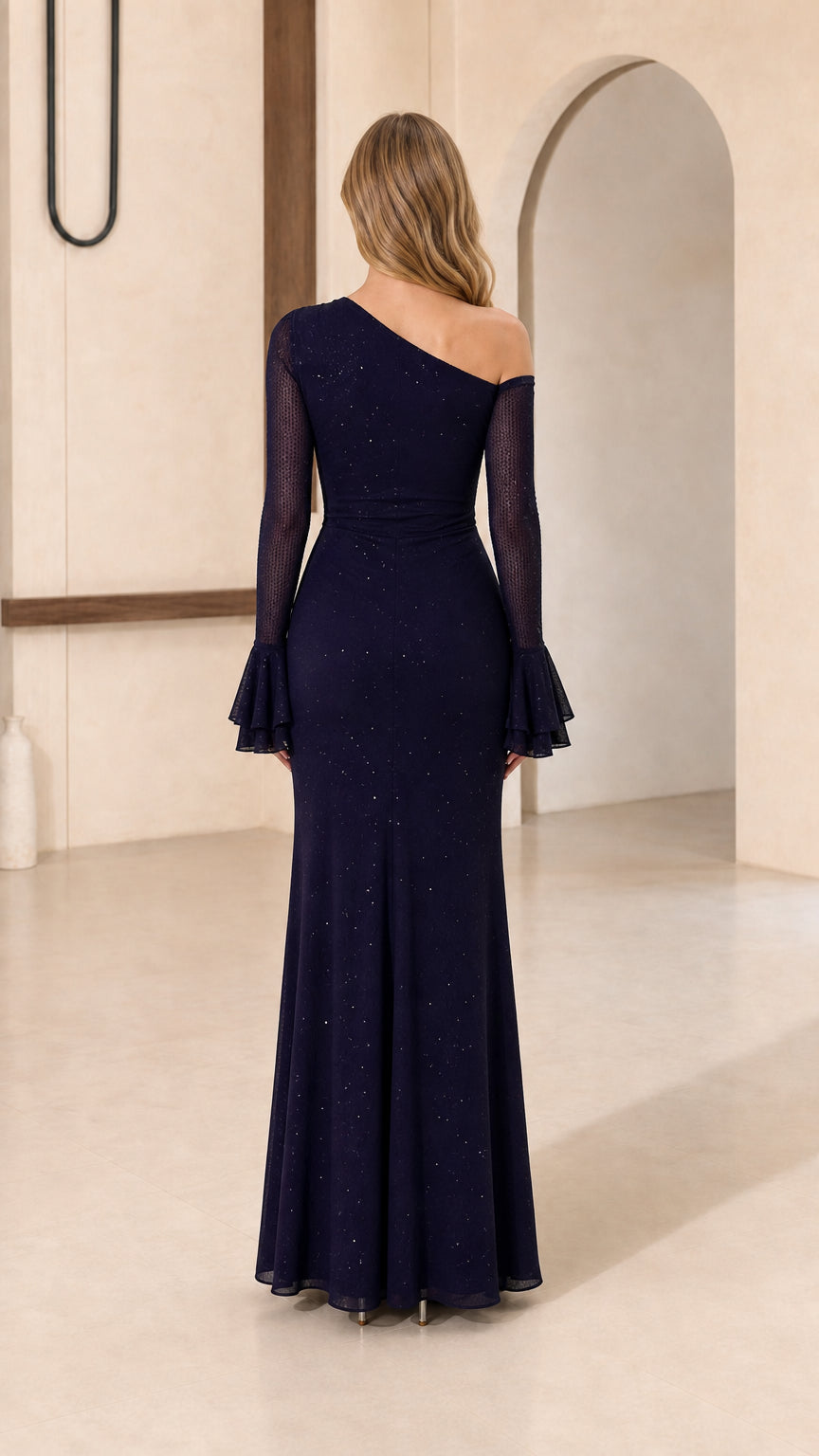 Model wearing navy one-shoulder evening gown, back view