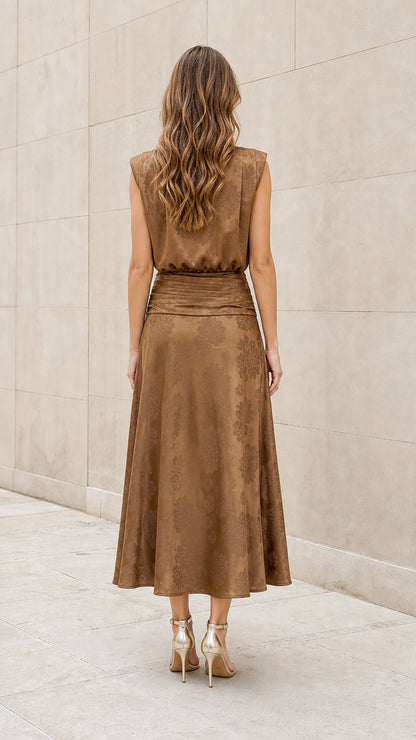Back view of model wearing brown tie-neck midi dress