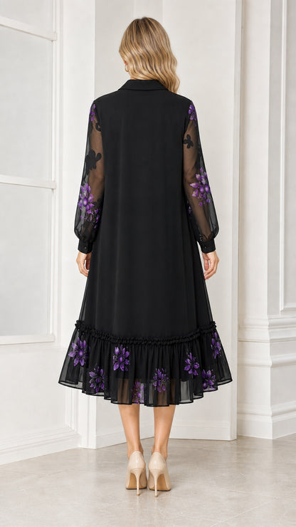 Back view of woman wearing black floral embroidered midi dress