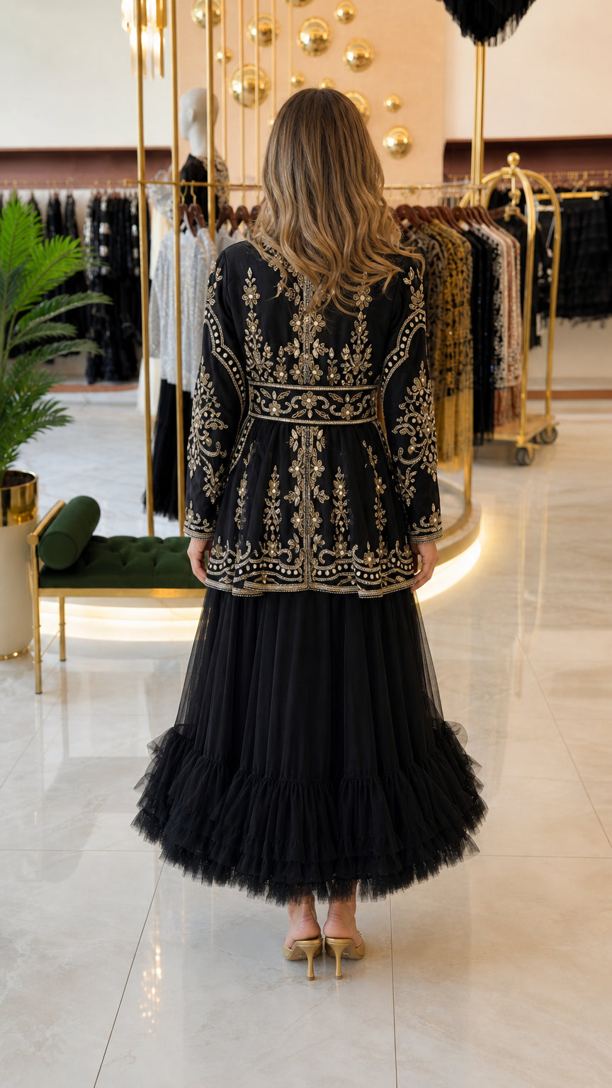 Back view of black embroidered peplum dress showing ruffled tulle skirt