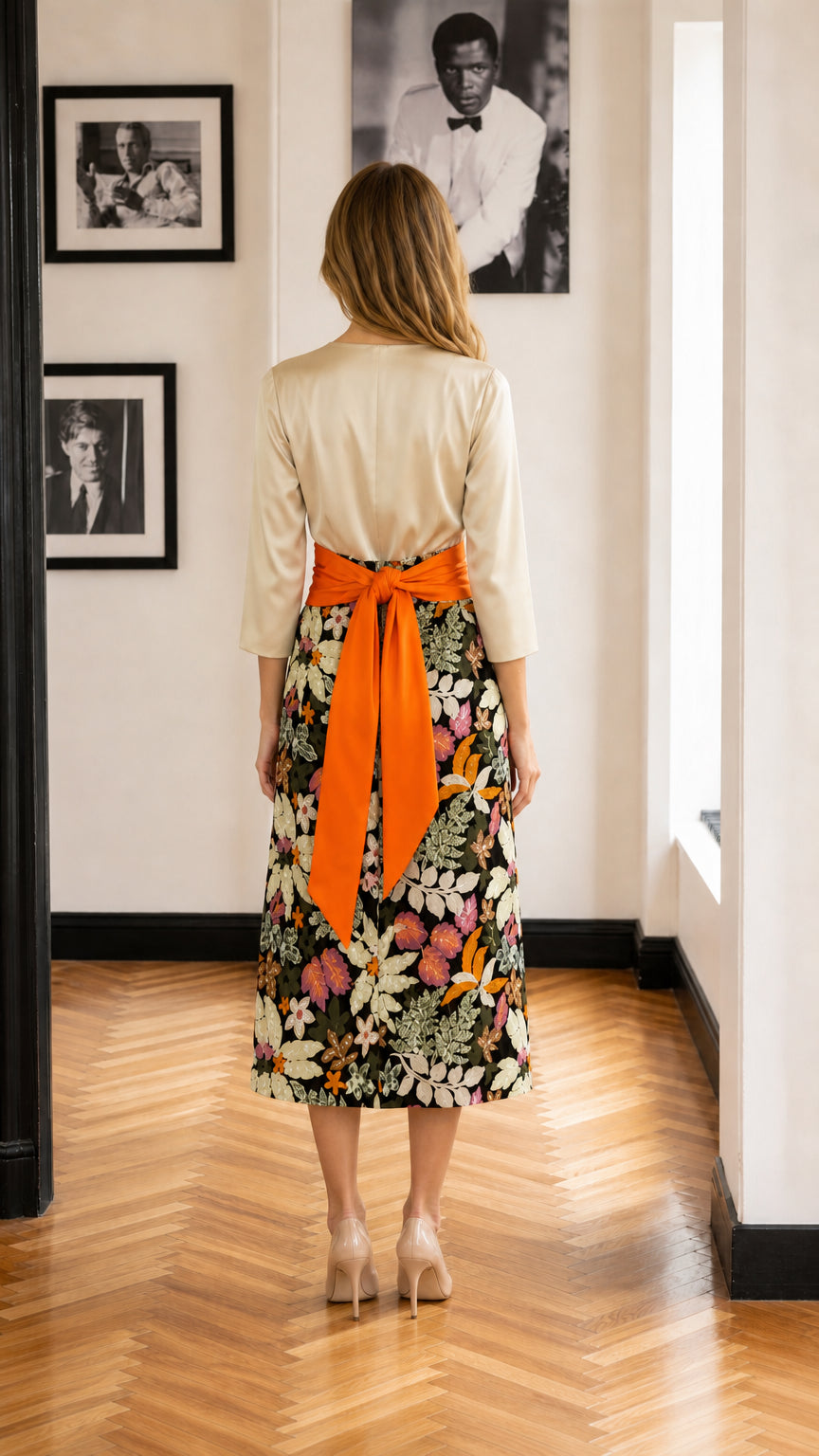 Back view of model showing bow detail on orange waist sash