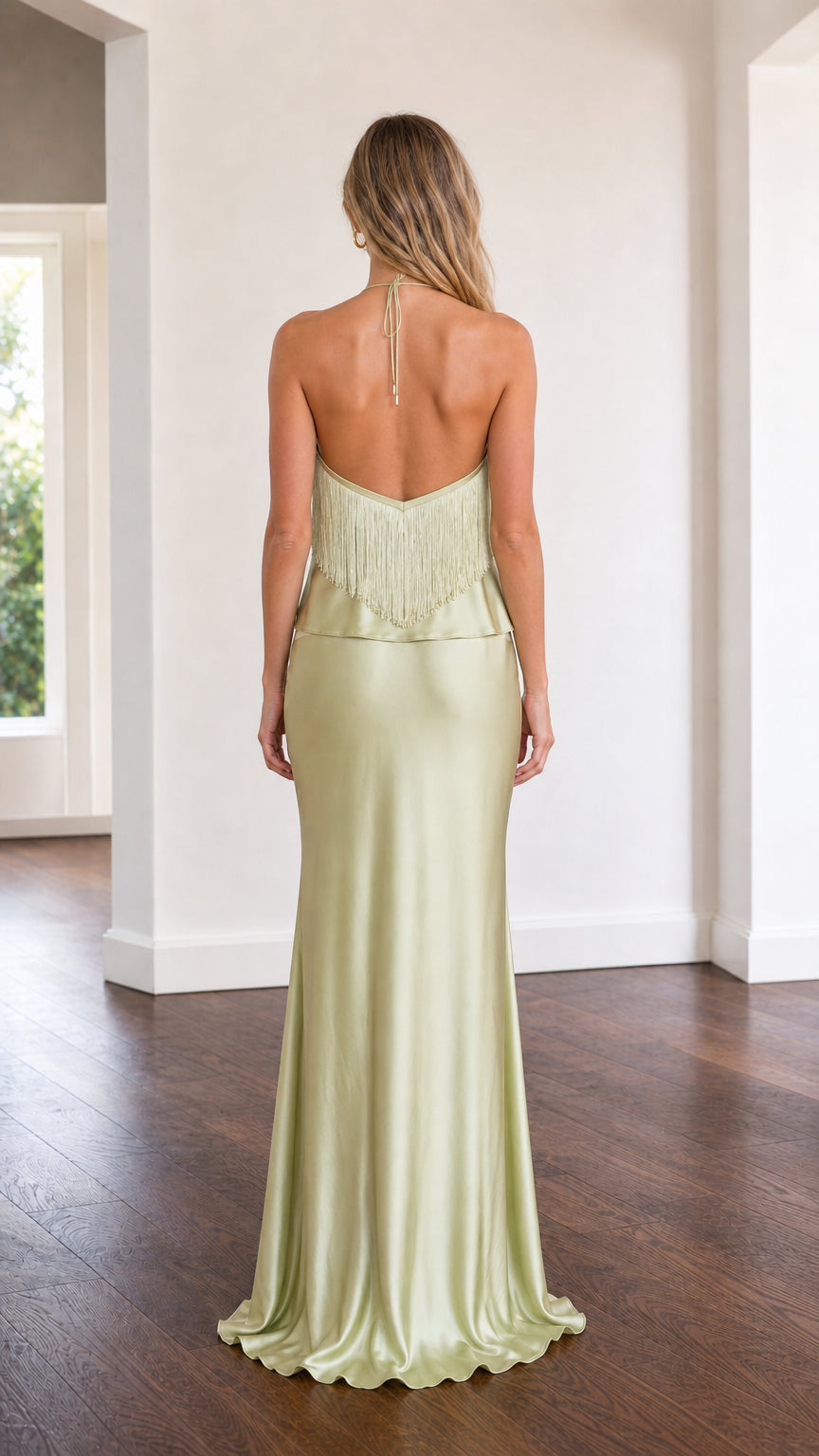 Back view of model showing open back details of sage green set